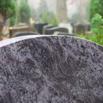 Blank,Granite,Tombstone,Without,Inscription;,Other,Tombstones,In,The,Background