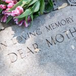 Grave,Marker,In,Cemetery,With,Flowers,For,Concept,Of,Death